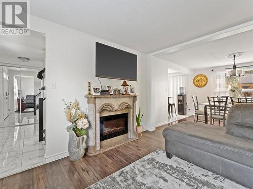 10265 Shenandoah, Windsor, ON - Indoor Photo Showing Living Room With Fireplace