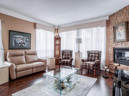 Salon - 303-1101 Boul. Lucille-Teasdale, Terrebonne (Lachenaie), QC - Indoor Photo Showing Living Room With Fireplace