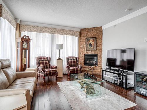 Salon - 303-1101 Boul. Lucille-Teasdale, Terrebonne (Lachenaie), QC - Indoor Photo Showing Living Room With Fireplace