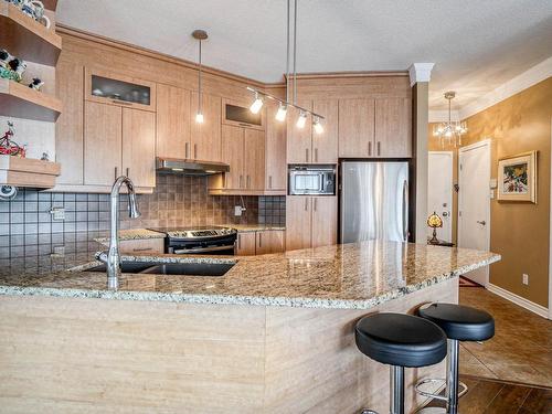 Cuisine - 303-1101 Boul. Lucille-Teasdale, Terrebonne (Lachenaie), QC - Indoor Photo Showing Kitchen With Upgraded Kitchen