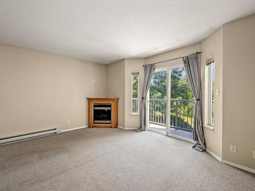 210-2767 Muir Rd, Courtenay, BC - Indoor Photo Showing Living Room With Fireplace