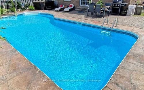 65 Clayton Crescent, Clarington (Bowmanville), ON - Outdoor With In Ground Pool With Backyard