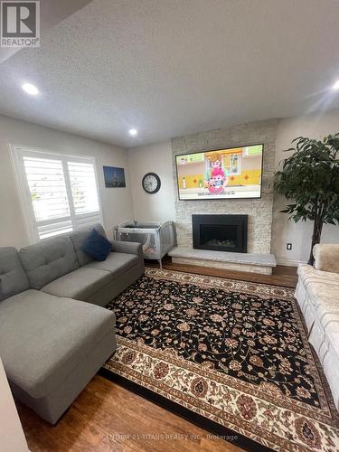 65 Clayton Crescent, Clarington (Bowmanville), ON - Indoor Photo Showing Living Room With Fireplace