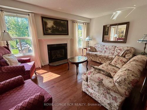 33 Prince Of Wales Dr, Barrie, ON - Indoor Photo Showing Living Room With Fireplace