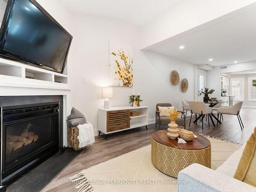 117-2110 Cleaver Ave, Burlington, ON - Indoor Photo Showing Living Room With Fireplace