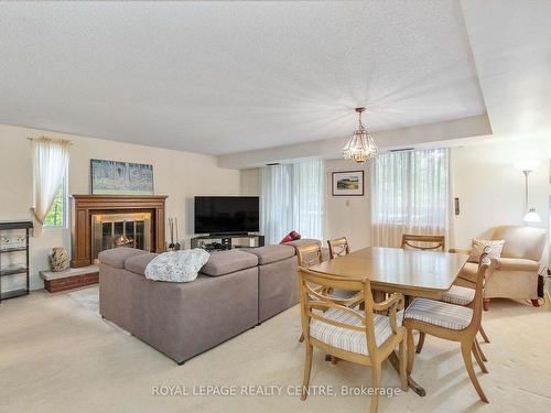 18-1330 Mississauga Valley Blvd, Mississauga, ON - Indoor Photo Showing Living Room With Fireplace