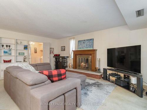 18-1330 Mississauga Valley Blvd, Mississauga, ON - Indoor Photo Showing Living Room With Fireplace