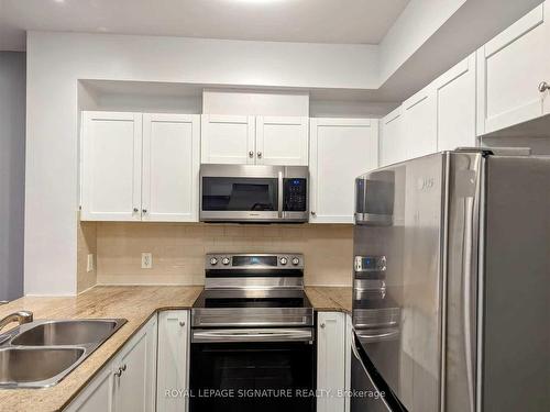 318-3504 Hurontario St, Mississauga, ON - Indoor Photo Showing Kitchen With Stainless Steel Kitchen With Double Sink