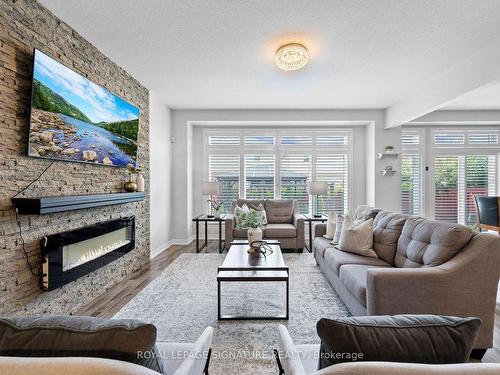 39 Weathering Hts, Hamilton, ON - Indoor Photo Showing Living Room With Fireplace