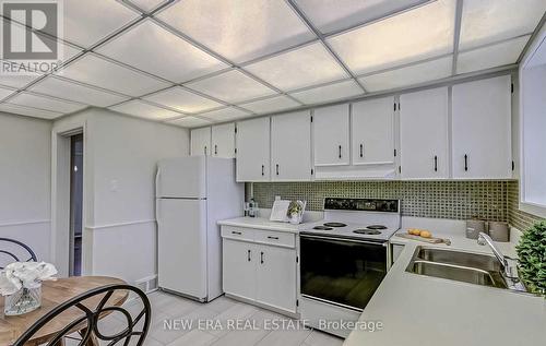 7 Greening Crescent, Toronto (Princess-Rosethorn), ON - Indoor Photo Showing Kitchen With Double Sink