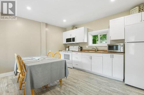 New cabinetry flooring, lighting.... - 24 Munroe Avenue E, Renfrew, ON - Indoor Photo Showing Kitchen With Double Sink