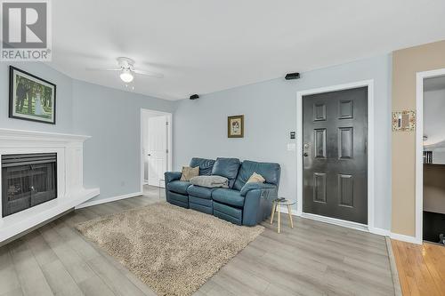 723 Cassiar Place, Kelowna, BC - Indoor Photo Showing Living Room With Fireplace