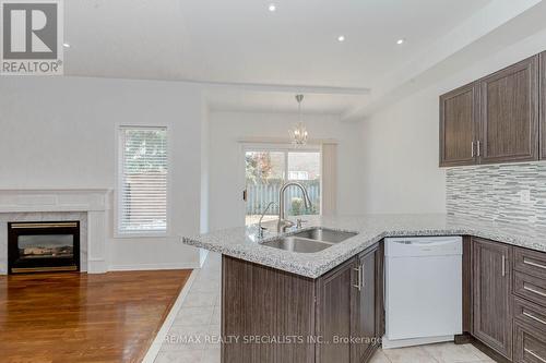 3056 Mcdowell Drive, Mississauga (Churchill Meadows), ON - Indoor Photo Showing Kitchen With Fireplace With Double Sink With Upgraded Kitchen