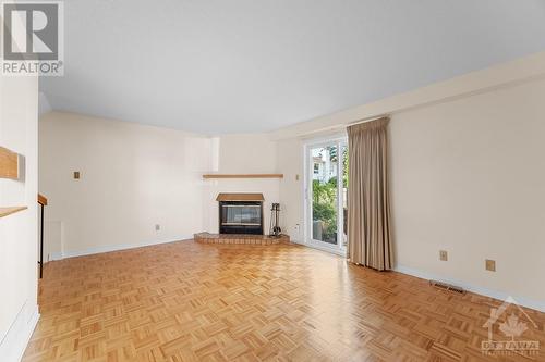 14 Castlebrook Lane Unit#E, Ottawa, ON - Indoor Photo Showing Living Room With Fireplace