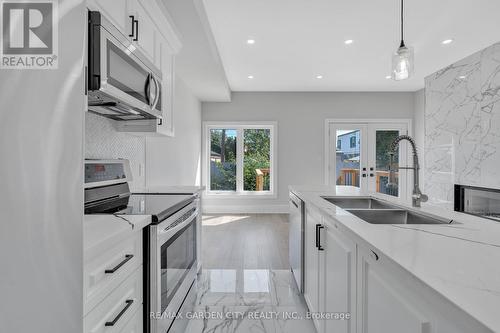 86 Beland Avenue N, Hamilton (Mcquesten), ON - Indoor Photo Showing Kitchen With Double Sink With Upgraded Kitchen