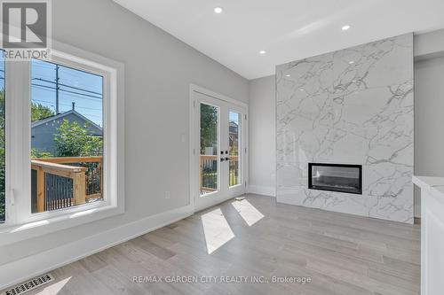 86 Beland Avenue N, Hamilton (Mcquesten), ON - Indoor Photo Showing Living Room With Fireplace