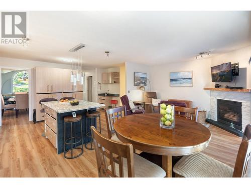 2613 Copper Ridge Drive, West Kelowna, BC - Indoor Photo Showing Dining Room With Fireplace