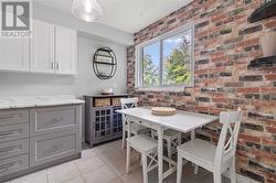 Eating area with faux brick accent wall - 