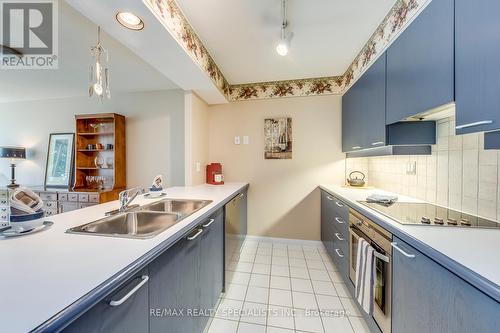 403 - 50 Eglinton Avenue W, Mississauga (Hurontario), ON - Indoor Photo Showing Kitchen With Double Sink With Upgraded Kitchen