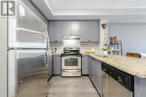 319 - 570 Lolita Gardens, Mississauga (Mississauga Valleys), ON - Indoor Photo Showing Kitchen With Stainless Steel Kitchen With Double Sink