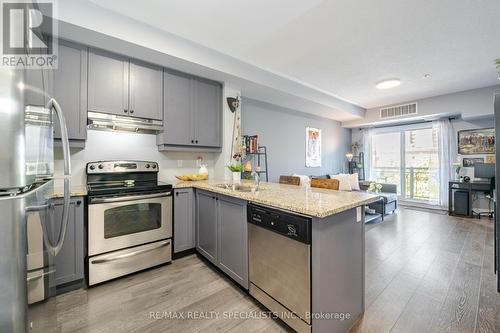 319 - 570 Lolita Gardens, Mississauga (Mississauga Valleys), ON - Indoor Photo Showing Kitchen With Stainless Steel Kitchen With Double Sink