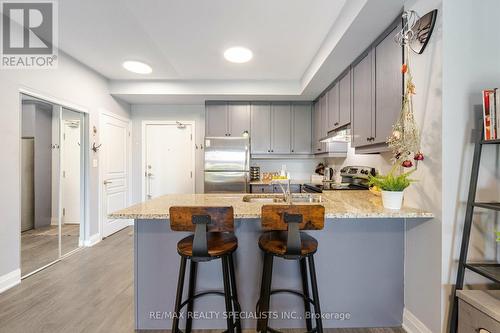 319 - 570 Lolita Gardens, Mississauga (Mississauga Valleys), ON - Indoor Photo Showing Kitchen With Stainless Steel Kitchen With Double Sink With Upgraded Kitchen