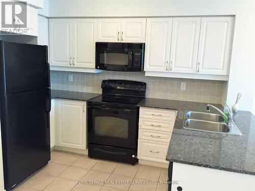 203 - 185 Oneida Crescent, Richmond Hill (Langstaff), ON - Indoor Photo Showing Kitchen With Double Sink