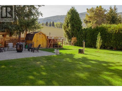 795 Smith  Crescent, Genelle, BC - Outdoor With Backyard