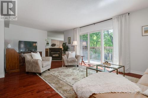 14 - 1160 Walden Circle, Mississauga (Clarkson), ON - Indoor Photo Showing Living Room With Fireplace