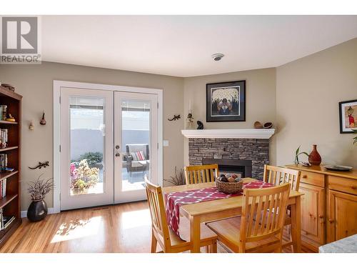 615 Glenmeadows Road Unit# 7, Kelowna, BC - Indoor Photo Showing Dining Room With Fireplace