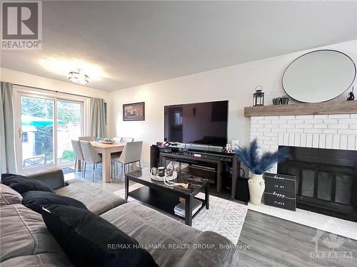 40 Stable Way, Ottawa, ON - Indoor Photo Showing Living Room With Fireplace