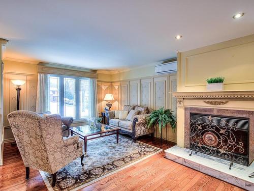 Living room - 1553 Boul. Jolibourg, Laval (Sainte-Dorothée), QC - Indoor Photo Showing Living Room With Fireplace