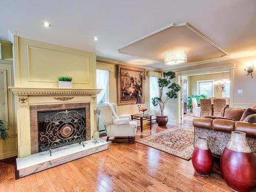 Family room - 1553 Boul. Jolibourg, Laval (Sainte-Dorothée), QC - Indoor Photo Showing Living Room With Fireplace