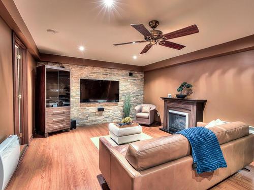 Playroom - 1553 Boul. Jolibourg, Laval (Sainte-Dorothée), QC - Indoor Photo Showing Living Room With Fireplace