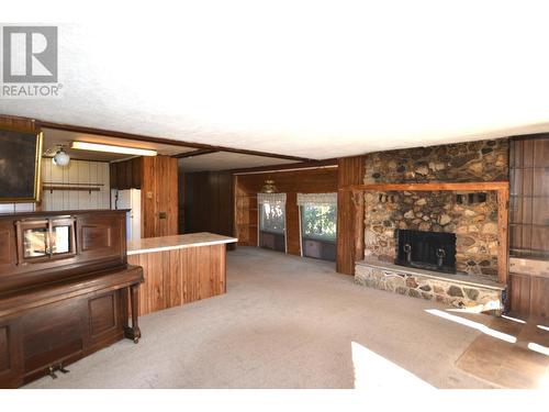 3085 De Sous Road, Williams Lake, BC - Indoor Photo Showing Other Room With Fireplace