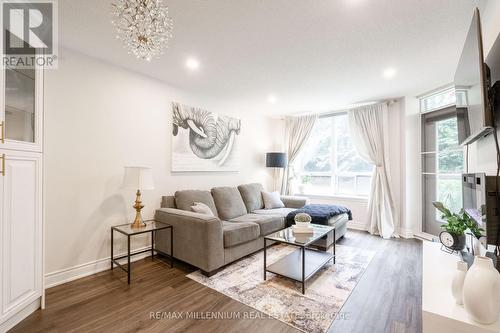 107 - 300 Ray Lawson Boulevard N, Brampton, ON - Indoor Photo Showing Living Room With Fireplace