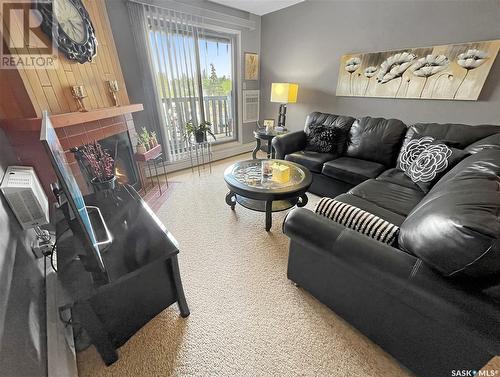 201 1110 9Th Avenue Ne, Swift Current, SK - Indoor Photo Showing Living Room With Fireplace