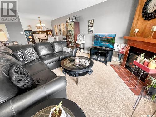 201 1110 9Th Avenue Ne, Swift Current, SK - Indoor Photo Showing Living Room With Fireplace