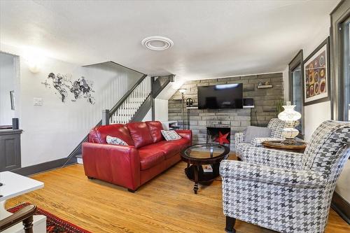 The cottage (unit 2) - 65 Queen Street, St. Catharines, ON - Indoor Photo Showing Living Room With Fireplace