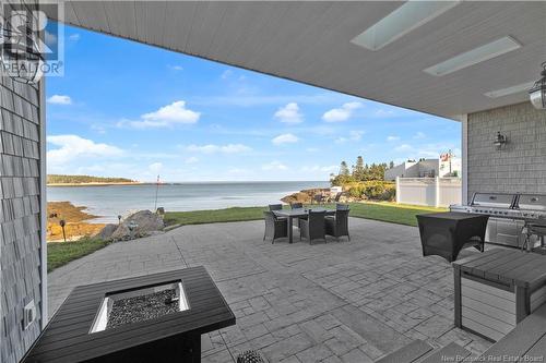 7 Long Beach Lane, Dipper Harbour, NB - Outdoor With Body Of Water With Deck Patio Veranda With Exterior