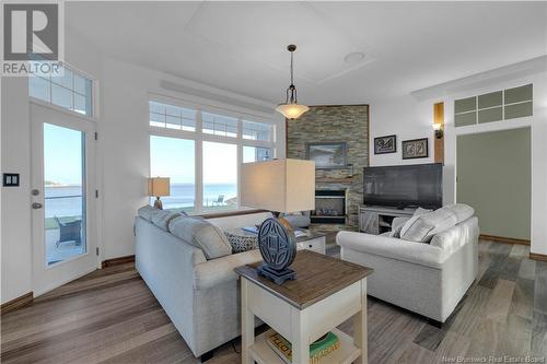 7 Long Beach Lane, Dipper Harbour, NB - Indoor Photo Showing Living Room With Fireplace