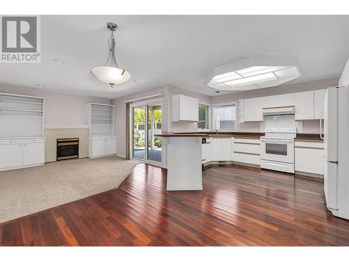 756 Springrose Way, Kelowna, BC - Indoor Photo Showing Kitchen With Fireplace