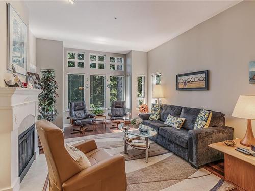 311-5660 Edgewater Lane, Nanaimo, BC - Indoor Photo Showing Living Room With Fireplace