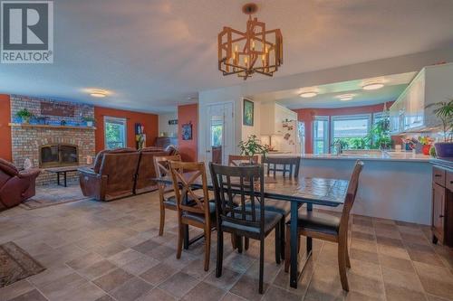 4525 Centre Road, Grand Forks, BC - Indoor Photo Showing Dining Room With Fireplace