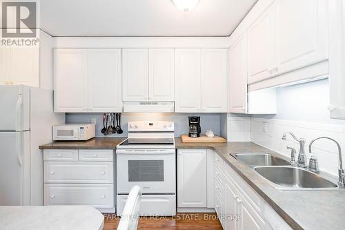 79 - 28 Donald Street, Barrie, ON - Indoor Photo Showing Kitchen With Double Sink