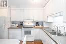 79 - 28 Donald Street, Barrie, ON  - Indoor Photo Showing Kitchen With Double Sink 