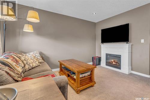 505 3830 Dewdney Avenue E, Regina, SK - Indoor Photo Showing Other Room With Fireplace