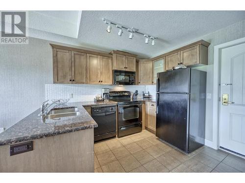 1200 Rancher Creek Road Unit# 32C, Osoyoos, BC - Indoor Photo Showing Kitchen With Double Sink