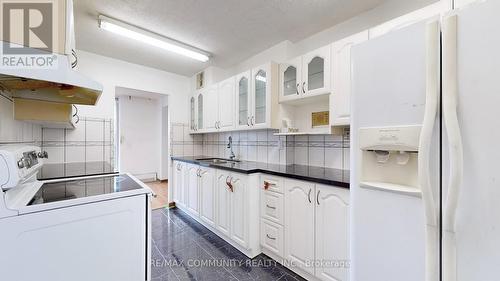 507 - 1250 Bridletowne Circle, Toronto (L'Amoreaux), ON - Indoor Photo Showing Laundry Room