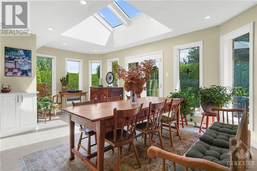 The gorgeous sun room and dining area with its skylight lends itself beautifully to family gatherings and informal dining. - 74 Trailway Circle, Ottawa, ON - Indoor